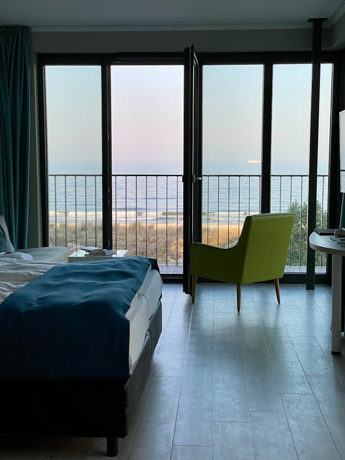 Bright hotel room with a sea view in Heringsdorf, Germany, featuring a modern interior.